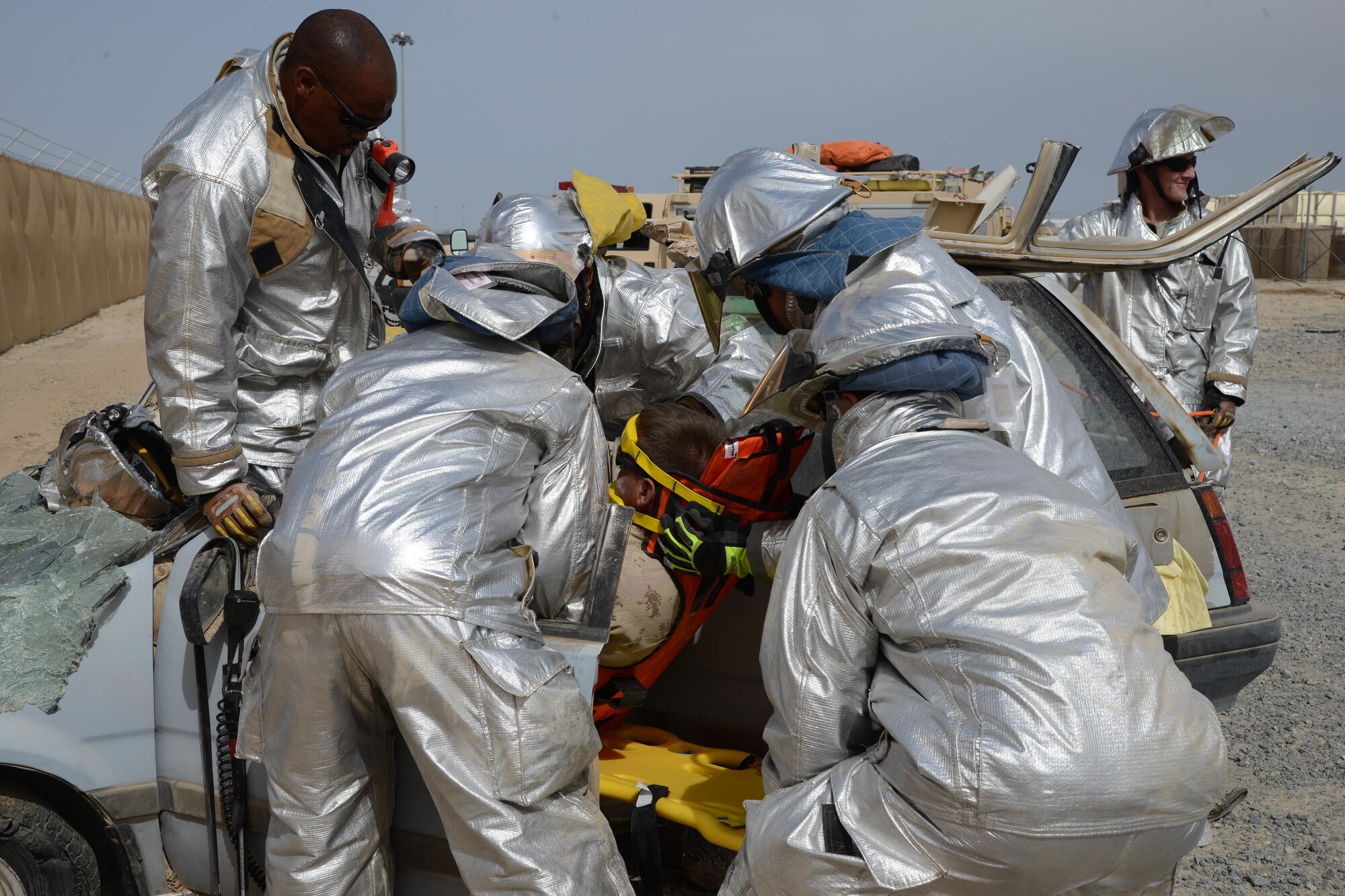 U.S. Air Force firefighters extricate a victim of a simulated vehicle accident during a U.S. and Canadian emergency response exercise April 14, 2015. The exercise evaluated coalition coordination and response efforts of U.S. and Canadian emergency services. (U.S. Air Force photo by Tech. Sgt. Jared Marquis/released)