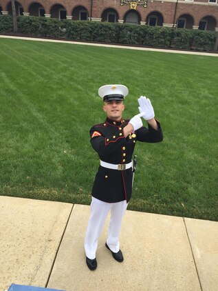 Lance Cpl. Alex Jarbo from Second Platoon “Earthpigs”, Alpha Co., demonstrates “the mitt,” a popular salutation residents of Michigan exchange with each other, during crowd education training at Marine Barracks Washington, D.C. Crowd educators are Marines from across the installation who volunteer to speak with Friday Evening Parade guests before the parade.  “I really wanted to do [crowd education] to learn how to open my voice in front of a large crowd of people in order to improve my leadership,” said Jarbo.  