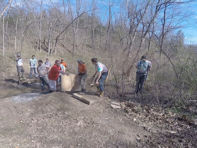 Volunteers work on an bridge replacement project during Take Pride in Blue Marsh Day in April of 2015. 400 volunteers took part in the annual tradition which encourages the public and organizations to get involved in the stewardship of public lands, waters and parks. 