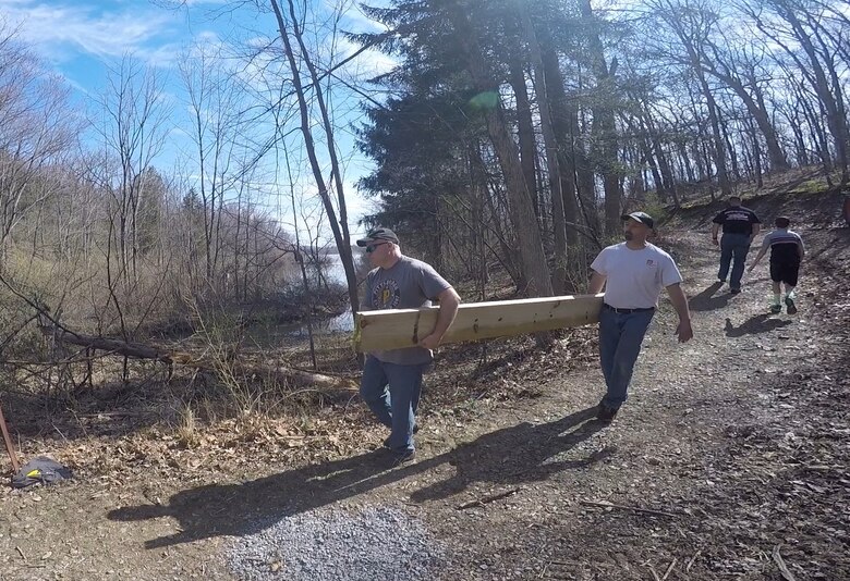 USACE Philadelphia District Chief of Operations Tony DePasquale (right) carries lumber with Assistant Chief of Operations Mike Landis during Take Pride in Blue Marsh Day in April of 2015. 400 volunteers took part in the annual tradition which encourages the public and organizations to get involved in the stewardship of public lands, waters and parks. 