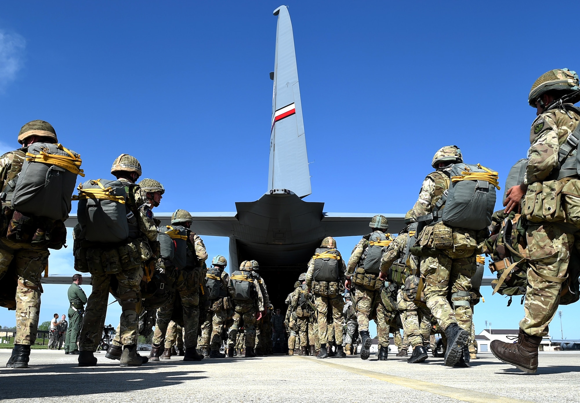 British Army parajumpers from the 16th Air Assault Brigade load onto a C-130J Super Hercules assigned to the 317th Airlift Group, Dyess Air Force Base, Texas, April 11, 2015, at Pope Army Airfield, N.C. During Combined Joint Operational Access Exercise 15-01, U.S. Air Force and Army personnel worked together with Royal Air Force and British Army personnel. Several days of training culminated with more than 2,100 parajumpers and hundreds of pounds of equipment being dropped during a Joint Forcible Entry Exercise. (U.S. Air Force photo/Senior Airman Peter Thompson)