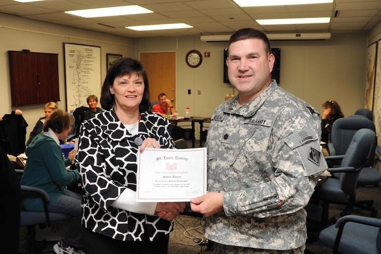 Edwardson, Baltimore District's new operations chief, receives a water safety award from former St. Louis District Deputy Commander Lt. Col. Robert Bayham in 2010.