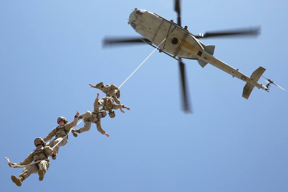 Reconnaissance Training Company Marines received an aerial view of Camp Pendleton during Special Patrol Insertion/Extraction training at San Mateo Landing Zone, April 17. The Marines, students of the Basic Reconnaissance Course, took turns being hoisted into the air by helicopter during the SPIE portion of their Helicopter Rope Suspension Training. During the course of HRST the students learn SPIE rigging, rappelling and fast rope techniques. 

