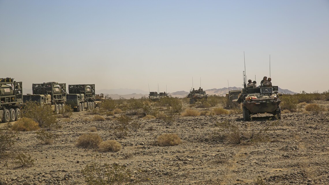 Marines with 3rd Light Armored Reconnaissance Battalion traverse the desert on the way to set up a forward combat operations center during Exercise Desert Scimitar, April 12, 2015, aboard the Combat Center. Division-level exercises, such as Desert Scimitar, allow division units to train in order to maintain mission readiness. 