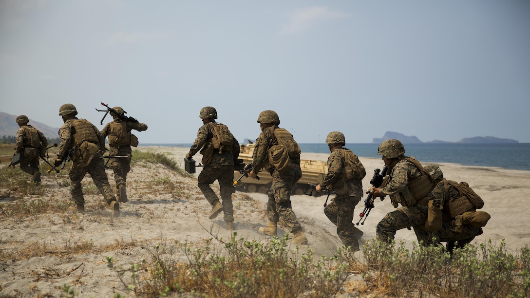 Marines with 3rd Marine Regiment sprint to set up a firing line, April 21, during a bilateral amphibious landing by the Philippine and U.S. Marines on North Beach at the Naval Education Training Center in Zambales, Philippines, as part of exercise Balikatan 2015. Designed to assault any shoreline from the well decks of Navy assault ships, Amphibious Assault Vehicles are highly mobile, tracked armored amphibious vehicles that transport Marines and cargo to and through hostile territory. Balikatan, which translates to “shoulder-to-shoulder” in Filipino, is an annual bilateral exercise between the AFP and the U.S. military, which focuses on improving security cooperation activities, humanitarian assistance and disaster relief capabilities, and crisis response throughout the region in accordance with the Mutual Defense Board and Security Engagement Board.