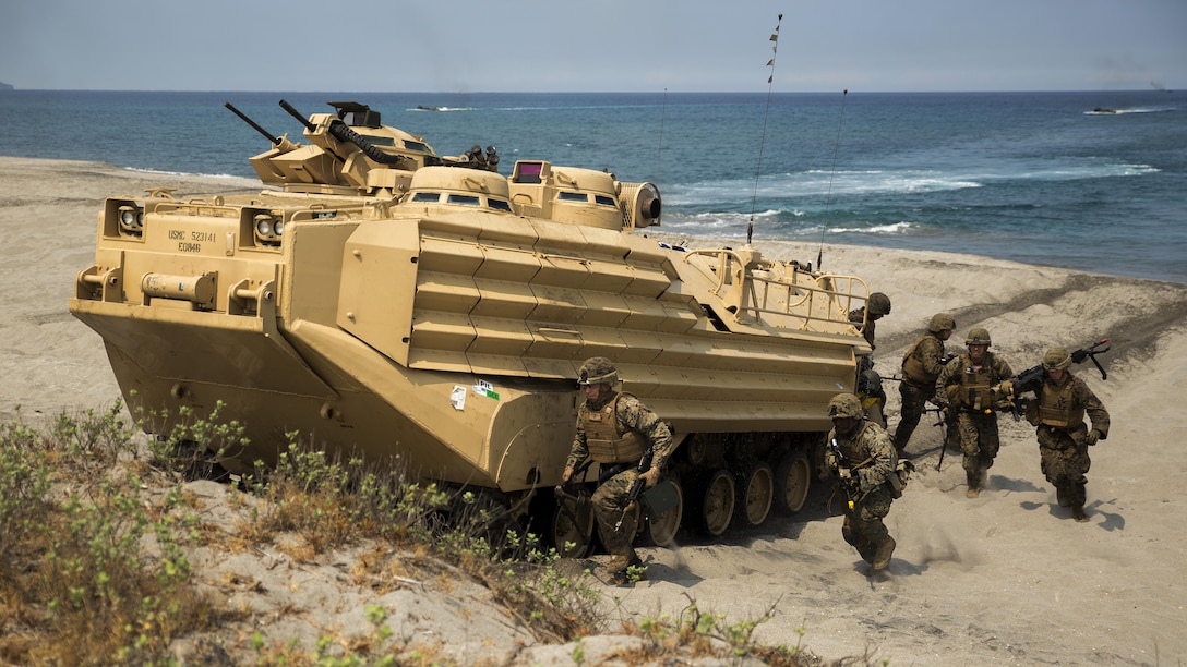 Marines with 3rd Marine Regiment exit an Amphibious Assault Vehicle carrying Philippine and U.S. Marines, April 21, during a bilateral amphibious landing on North Beach at the Naval Education Training Center in Zambales, Philippines, as part of exercise Balikatan 2015. Designed to assault any shoreline from the well decks of Navy assault ships, AAVs are highly mobile, tracked armored amphibious vehicles that transport Marines and cargo to and through hostile territory. Balikatan, which translates to “shoulder-to-shoulder” in Filipino, is an annual bilateral exercise between the AFP and the U.S. military, which focuses on improving security cooperation activities, humanitarian assistance and disaster relief capabilities, and crisis response throughout the region in accordance with the Mutual Defense Board and Security Engagement Board.