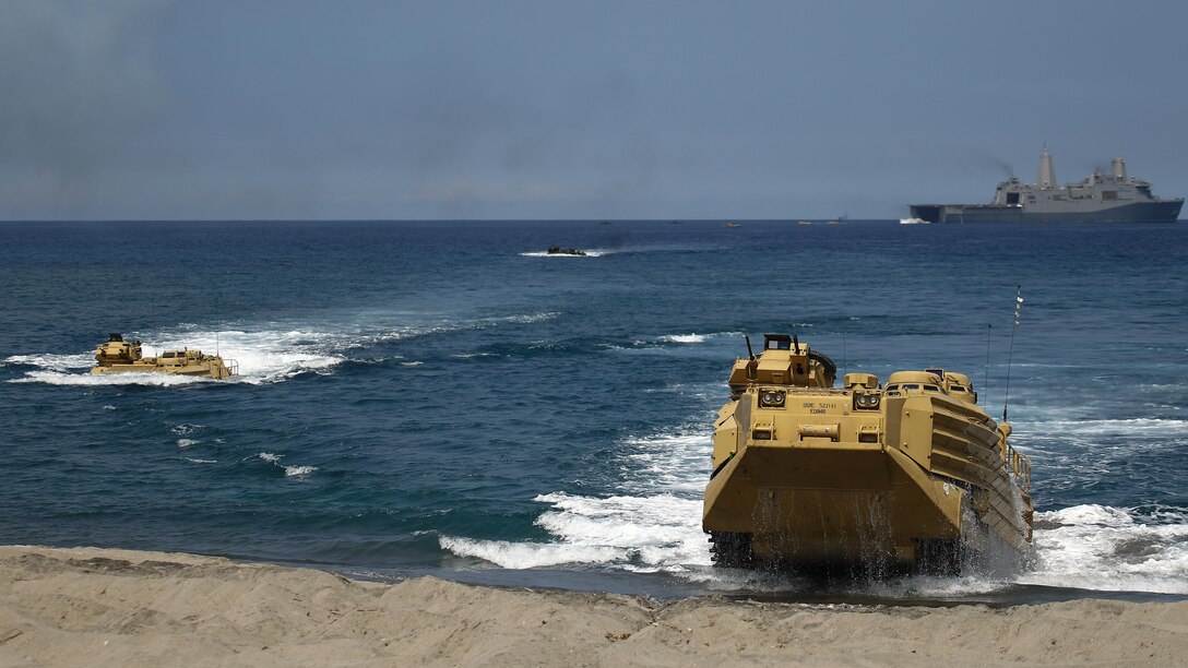 ZAMBALES, Philippines - Amphibious Assault Vehicles land ashore during a bilateral amphibious landing by the Philippine and U.S. Marine Corps, April 21, on North Beach at the Naval Education Training Center in Zambales, Philippines, as part of exercise Balikatan 2015. Designed to assault any shoreline from the well decks of Navy assault ships, AAVs are highly mobile, tracked armored amphibious vehicles that transport Marines and cargo to and through hostile territory. Balikatan, which means “shoulder-to-shoulder” in Filipino, is an annual bilateral training exercise held since 1984, aimed at improving the ability of Philippine and U.S. military forces to work together during planning, humanitarian assistance and disaster relief operations.