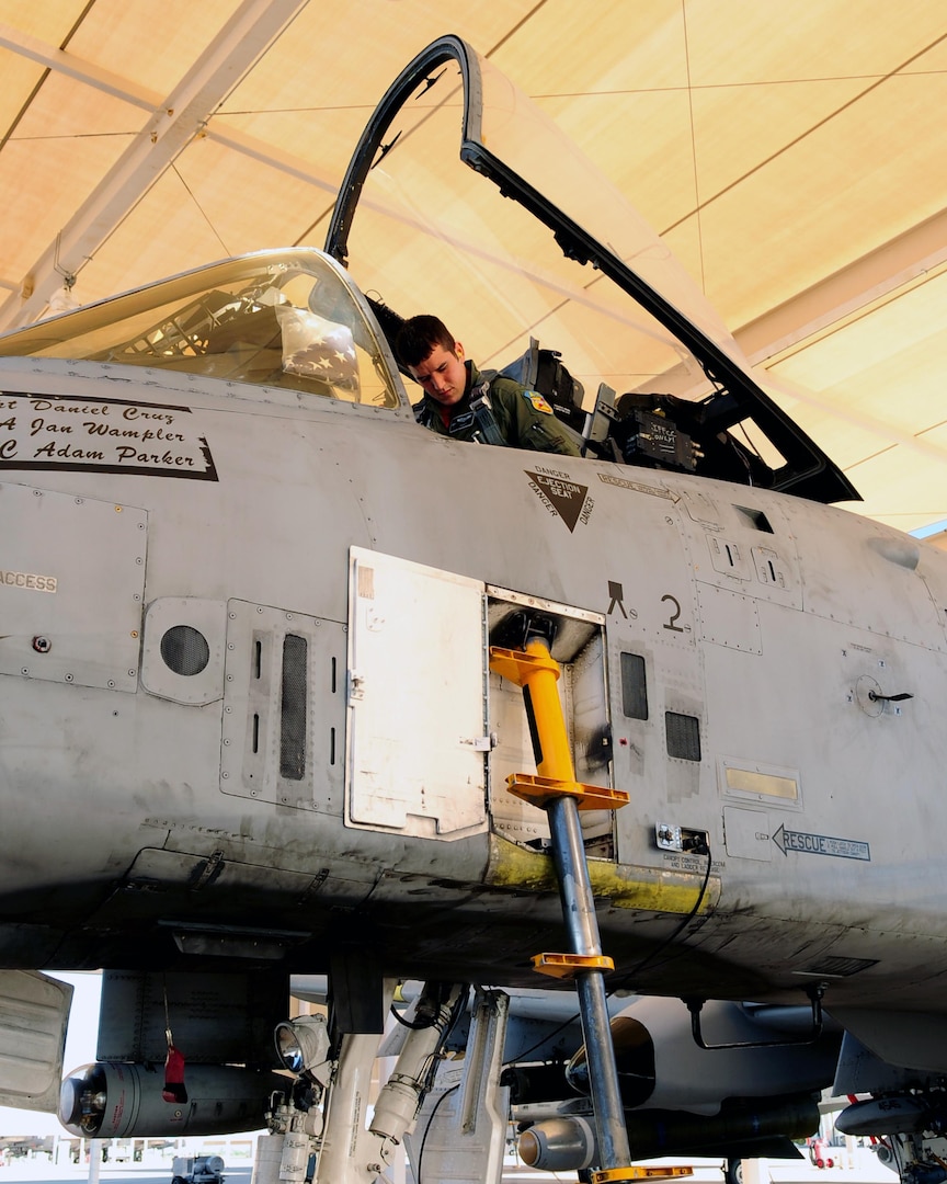 1st Lt. Dan Griffin, a pilot with the 175th Wing of the Maryland Air National Guard, checks his aircraft on the flight line here before taking off for his final training sortie Aug. 13, 2010. It was the last milestone in his 27-week A-10C Pilot Initial Qualification Course.
