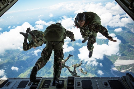 In this file photos, Philippine Army Special Forces free-fall parachutists jump from a KC-130J "Sumos" aircraft over Crow Valley, Philippines, May 15, 2014, during high-altitude low-opening jump training at Balikatan 2014. This year is the 31st iteration of Balikatan, an annual Philippines-U.S. military bilateral training exercise. 