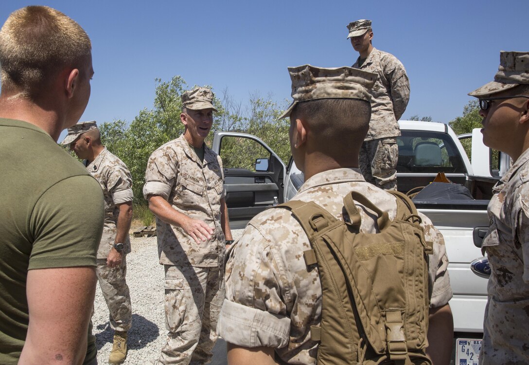 Col. John Farnam, Marine Corps Air Station Miramar commanding officer, talks to Marines during a station-wide cleanup aboard MCAS Miramar, California, April 20. Farnam made stops in each of the sectors to give his appreciation to all the service members.