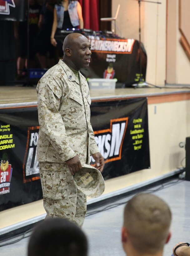 Sergeant Major of the Marine Corps, Sgt. Maj. Ronald L. Green, addresses Combat Center Marines and sailors at the Sunset Cinema during the Ultimate Fighting Championship Clinic and Fight Night Viewing, April 18, 2015. Green thanked the Marines and sailors for the hard work they do in support of the Combat Center. (Official Marine Corps photo by Lance Cpl. Medina Ayala-Lo/Released)