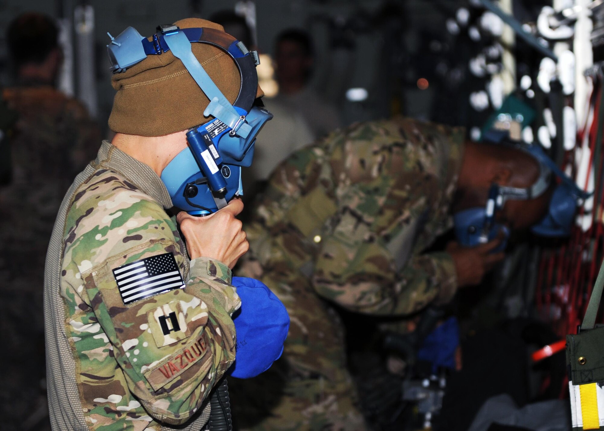U.S. Air Force Capt. Maria Vazquez, 455th Expeditionary Aeromedical Evacuation Squadron flight nurse, tests an oxygen mask in preparation for an AE mission April 19, 2015 at Bagram Airfield, Afghanistan. 455 EAES Airmen are charged with the responsibility of evacuating the sick and wounded from Central Command to higher echelons of medical care. (U.S. Air Force photo by Staff Sgt. Whitney Amstutz/released)