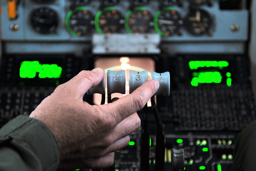 Maj. Scott Fisher, 506th Expeditionary Aerial Refueling Squadron pilot, adjusts the throttle on a KC-135 Stratotanker during an aerial refueling mission in the Asia-Pacific region April 15, 2015. The tankers routinely support B-52 Stratofortress aircrews with refueling in support of U.S. Pacific Command’s Continuous Bomber Presence in the Asia-Pacific region. Fisher is deployed to Andersen Air Force Base, Guam, from the Pittsburgh International Airport Air Reserve Station, Pa. (U.S. Air Force photo by Staff Sgt. Melissa B. White/Released)