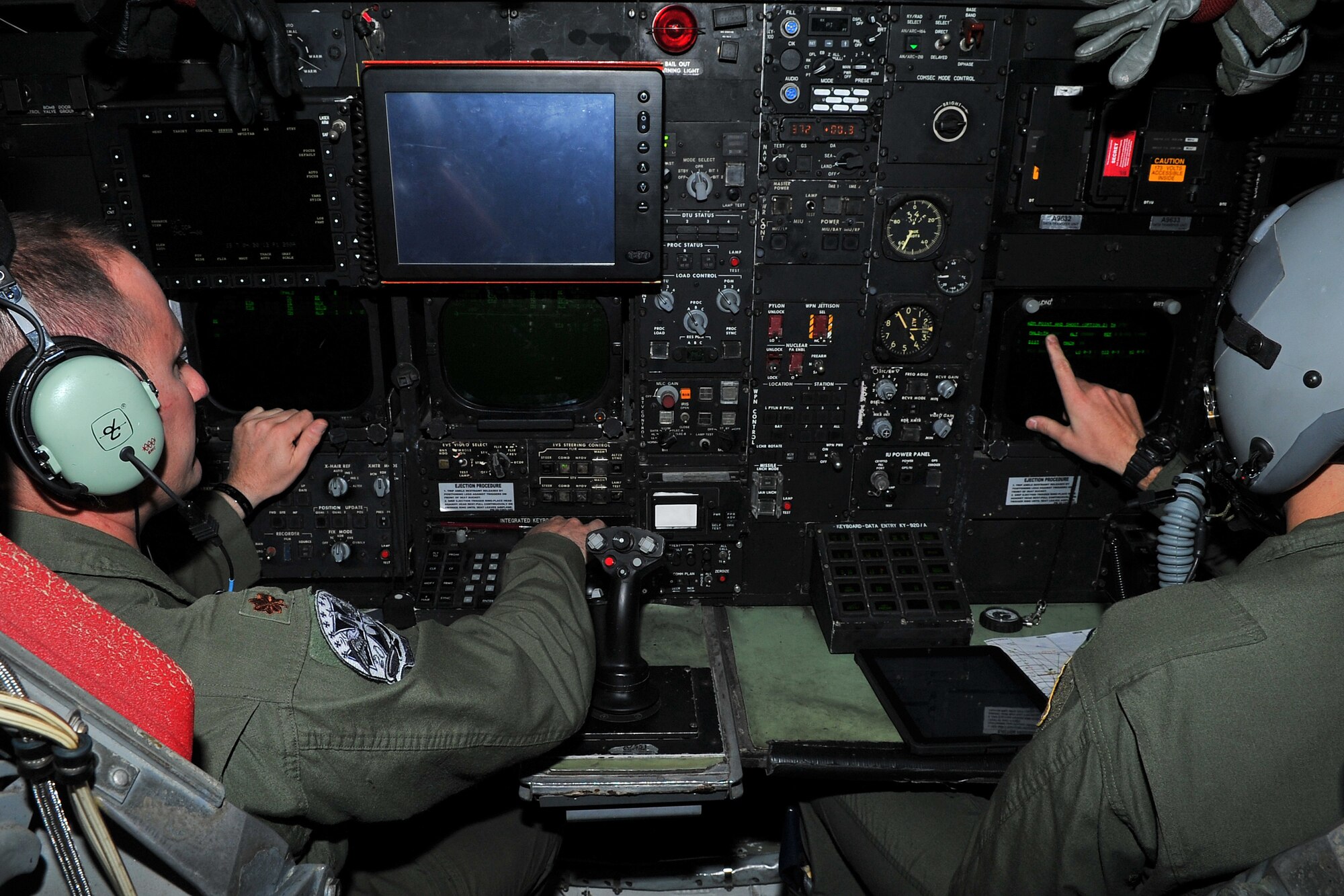 Maj. Andrew Marshall, 20th Expeditionary Bomb Squadron radar navigator, and 1st Lt. Bryant Curdy, 20th EBS navigator, implement an in-flight checklist during a B-52H Stratofortress training mission in the Asia-Pacific region April 15, 2015. The B-52 crews are deployed from Barksdale Air Force Base, La., to Andersen AFB, Guam, in support of U.S. Pacific Command’s Continuous Bomber Presence to strengthen regional security and stability. (U.S. Air Force photo by Staff Sgt. Melissa B. White/Released)