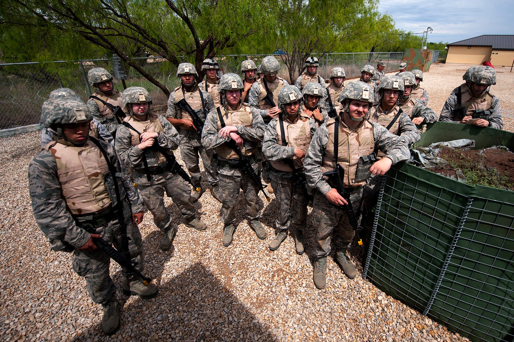 GOODFELLOW AIR FORCE BASE, Texas -- Angelo State University Air Force ROTC Detachment 847 cadets listen to a briefing before a field training exercise at Camp Sentinel April 17. During the FTX, the cadets trained on entry controller procedures, handling enemy prisoners of war, civil affairs and more. (U.S. Air Force photo/ Airman 1st Class Devin Boyer)