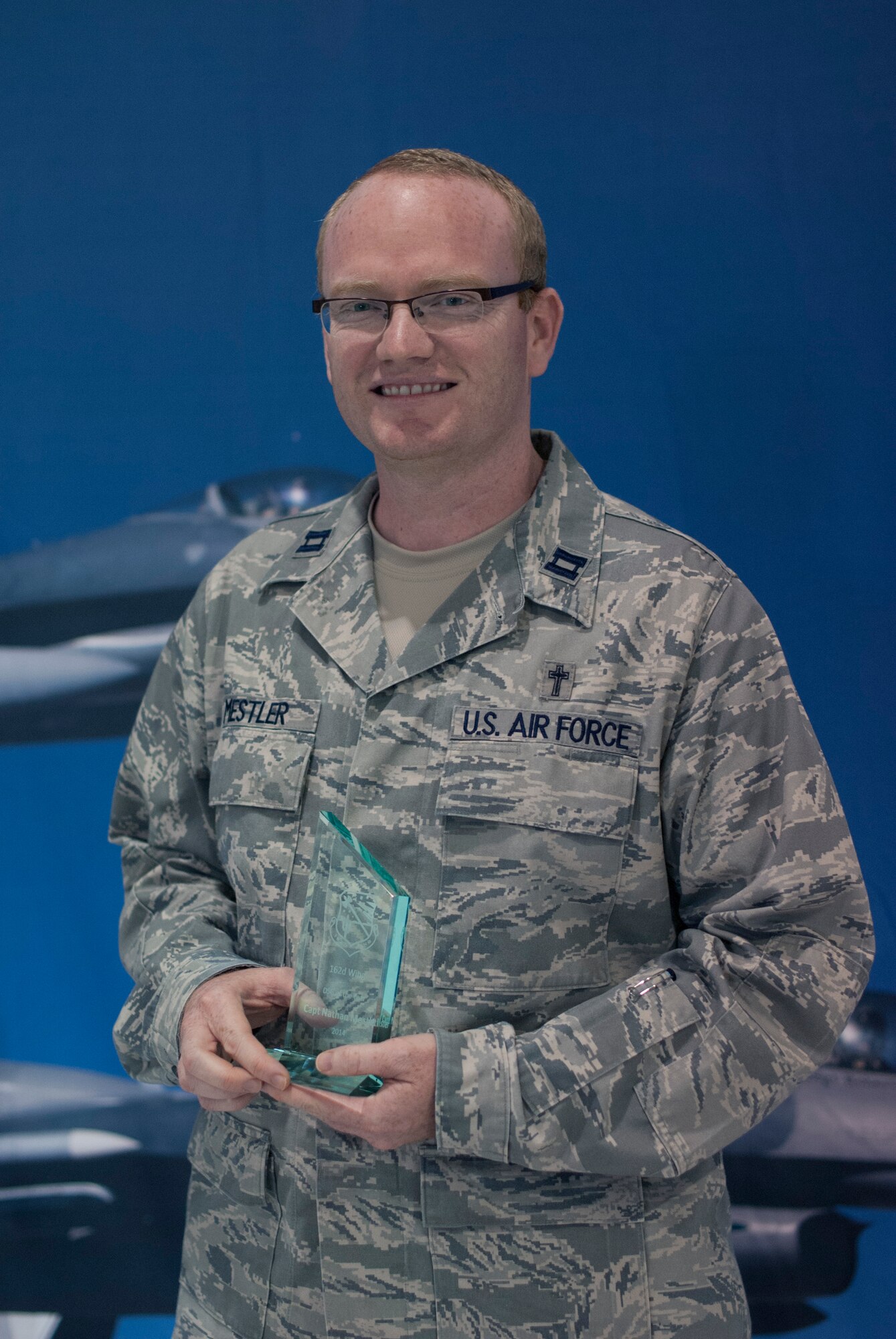 Capt. Nathan Mestler, a chaplain at the 162nd Wing was presented with the Drill Status Guardsmen of the Year award  during the 162nd Wing awards ceremony on April 12. (U.S. Air National Guard photo by Staff Sgt. Heather Davis)