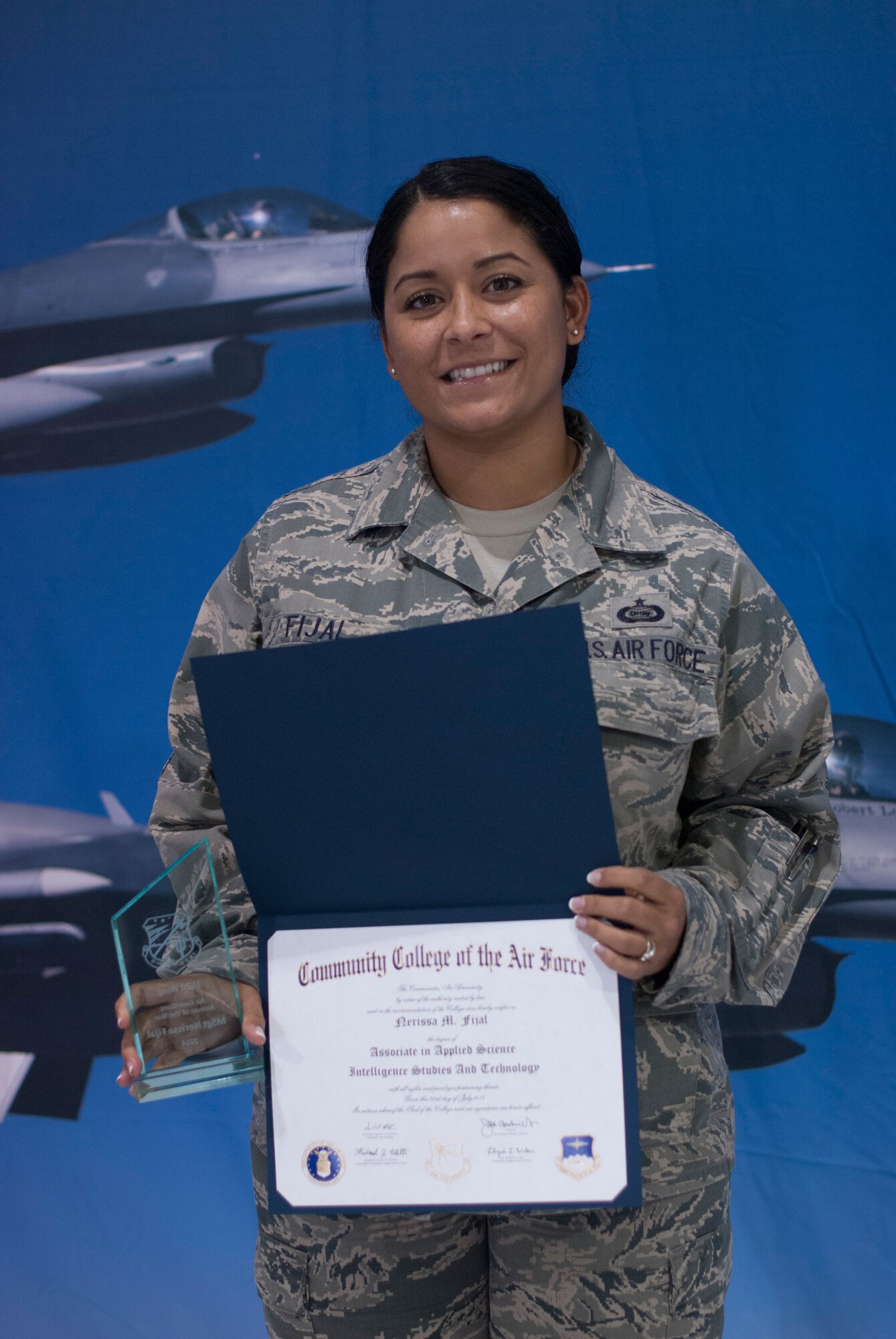 Master Sgt. Narissa Fijal, an intelligence analyst in the wing’s operations group, received two prestigious awards and was presented with her CCAF diploma during the 162nd Wing awards ceremony on April 12. (U.S. Air National Guard photo by Staff Sgt. Heather Davis)