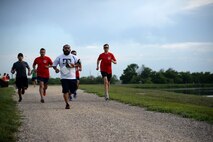 Competitors, at the Adventure Race XI, run on the track at Laughlin Air Force Base, Texas, April 18, 2015. Nearly 200 people, from the Val Verde County and surrounding cities, participated in the Adventure Race, which included a 3.5-mile run with three mystery challenges, a 23-mile bicycle ride and a mile-long water rafting portion. (U.S. Air Force photo by Airman 1st Class Ariel D. Partlow)