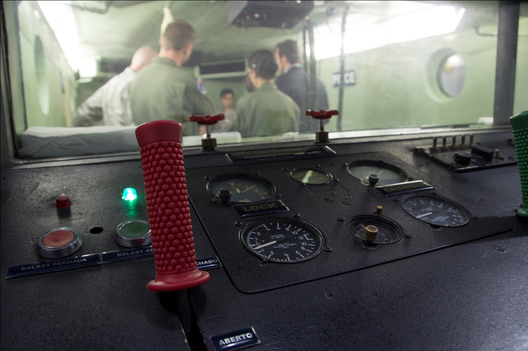 Members of the Brazilian air force give a brief presentation to U.S. Air Force members explaining the use and operation of their hypobaric chamber, April 20, 2015 in Rio de Janeiro, Brazil. The chamber simulates a high altitude environment and helps illustrate the effects of hypoxia on the human body. (U.S. Air Force photo by Staff Sgt. Adam Grant/Released)
