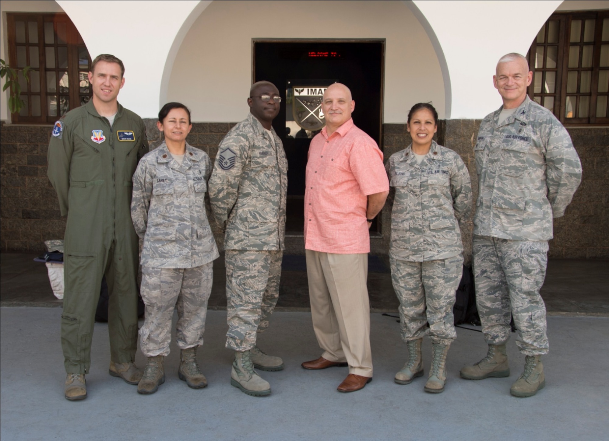 (Left) Maj. Brian Neese, 12th Air Force (Air Forces Southern) chief of international health specialists division; Maj. Janet Carey, 12th AF (AFSOUTH) international health specialists; Master Sgt. Kingsley Parker, Air Combat Command NCOIC of ground medical, Mr. Lewis Rissmiller, Air Combat Command surgeon general program manager, and Col. Elmo Robinson, Headquarters Air Force chief of expeditionary operations and policy, smile before departing a Brazilian medical facility during a one week stay in Rio de Janerio, Brazil on April 20, 2015. The team was selected for their expertise in all areas of EMEDS (U.S. Air Force photo by Staff Sgt. Adam Grant/Released)