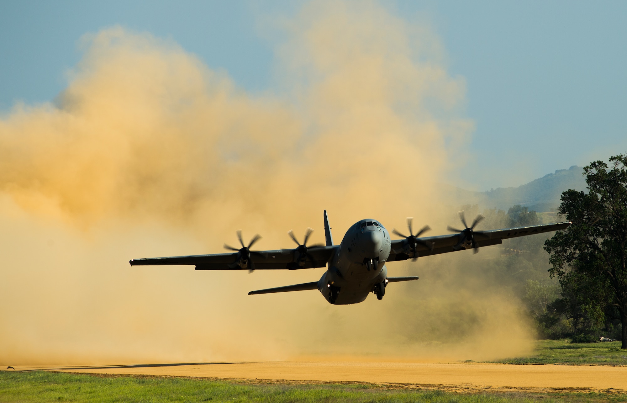 A C-130 Hercules Aircraft takesoff at Fort Hunter Liggett, Calif. during Exercise Golden Hydra on March 31, 2015. (Photo by U.S. Air Force Photojournalist Tech. Sgt. Matthew Hannen)   