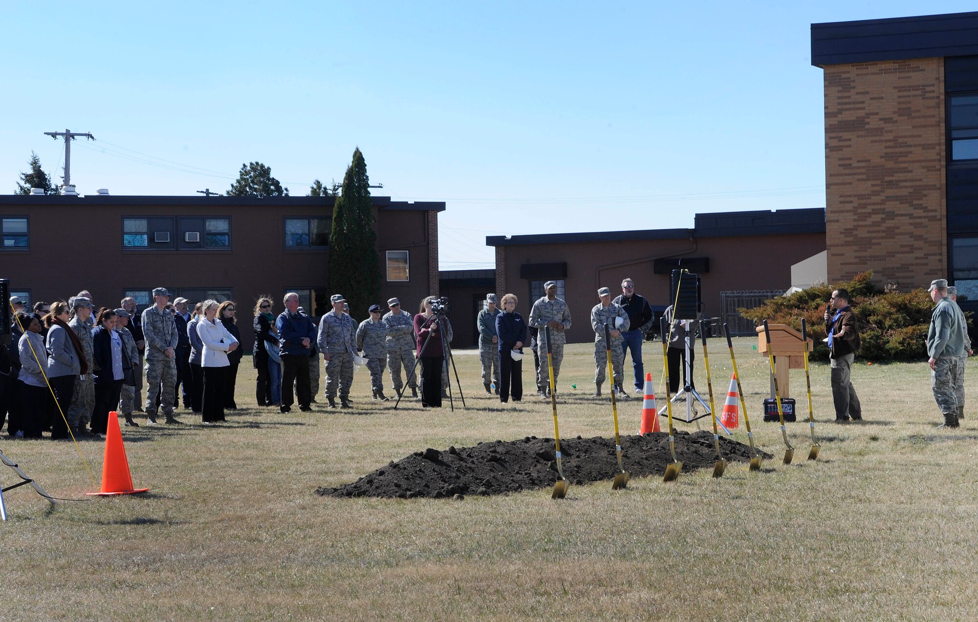 Base Airmen and their families attend a ground breaking ceremony for a new temporary lodging facility on Minot Air Force Base, N.D., April 20, 2015. The estimated completion date for construction is August 18, 2016 and the grand opening is projected for October 2016. (U.S. Air force photo/Senior Airman Stephanie Morris)