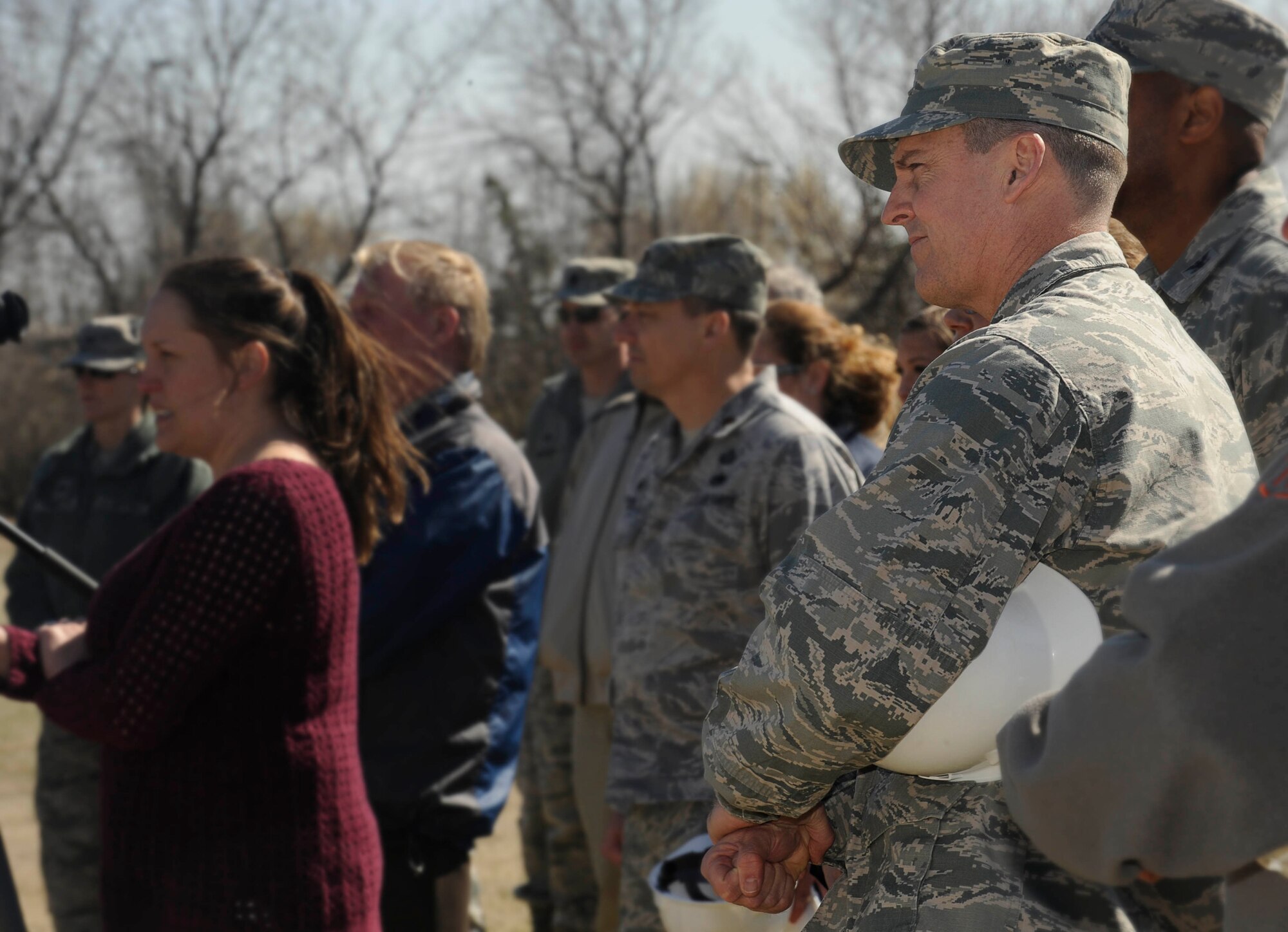 Col. Jason Armagost, 5th Bomb Wing commander, listens to a speaker during a ground breaking ceremony for a new temporary lodging facility on Minot Air Force Base, N.D., April 20, 2015. Once complete, the new facility will have 30-units, two of which will be handicap accessible and 12 will be pet-friendly units. (U.S. Air force photo/Senior Airman Stephanie Morris)