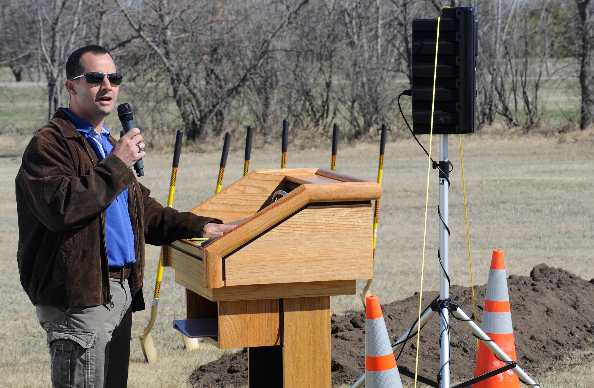 Craig Hilderbrant, prime contractor for a new 30-unit temporary lodging facility, speaks to Minot Airmen during the ground breaking ceremony on Minot Air Force Base, N.D., April 20, 2015. Once complete, each unit in the facility will be an apartment consisting of two bedrooms, a living room, bathroom, full kitchen and laundry facilities. (U.S. Air force photo/Senior Airman Stephanie Morris)