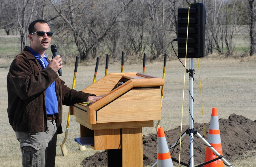 Craig Hilderbrant, prime contractor for a new 30-unit temporary lodging facility, speaks to Minot Airmen during the ground breaking ceremony on Minot Air Force Base, N.D., April 20, 2015. Once complete, each unit in the facility will be an apartment consisting of two bedrooms, a living room, bathroom, full kitchen and laundry facilities. (U.S. Air force photo/Senior Airman Stephanie Morris)