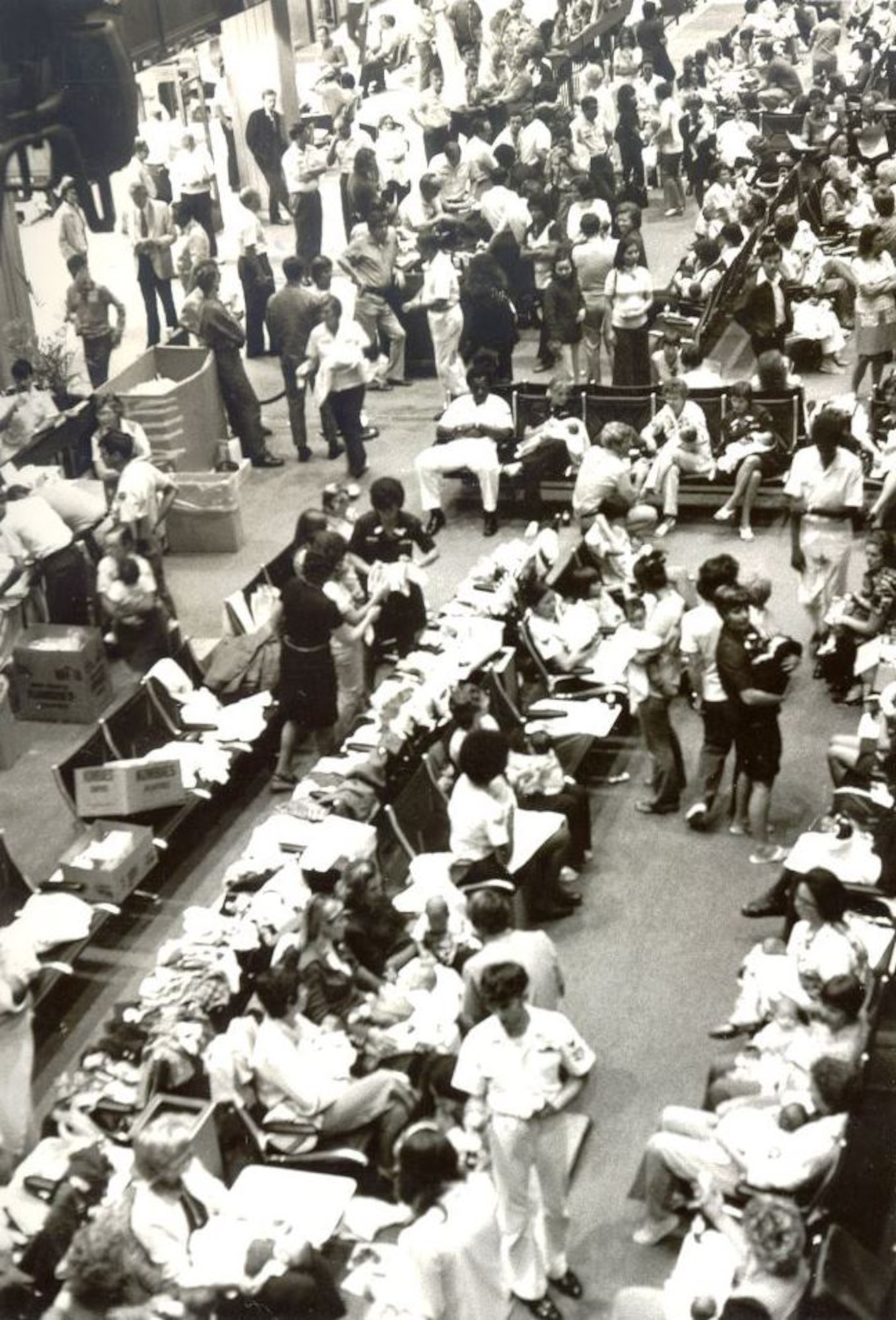 On 5 April 1975, the first plane full of Operation Baby Lift babies arrived at the Honolulu International Airport.  That night “temporary mothers and fathers” took care of the over 400 babies at in the airports holding area set up by Customs and Immigrations Officials until the aircraft departed the next morning.(U.S. Air Force photo provided by 15 WG historian office)