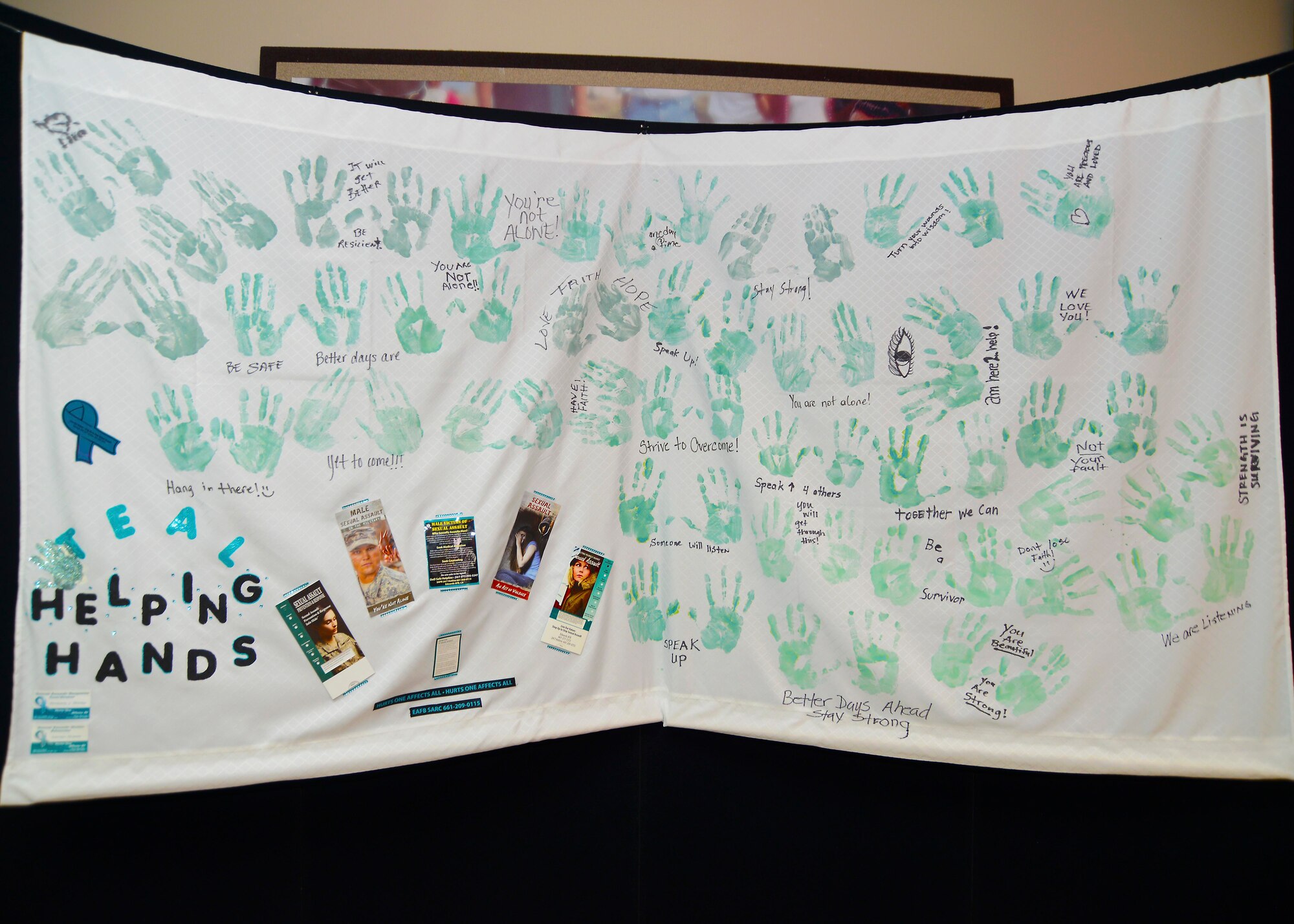 The Teal Helping Hands display, currently at the Oasis Community Center, is a traveling wall project presented by the 412th Test Wing's Sexual Assault Prevention Office. The display will also head to Bldg. 3000 next to close out Sexual Assault Prevention Month. (U.S. Air Force photo)