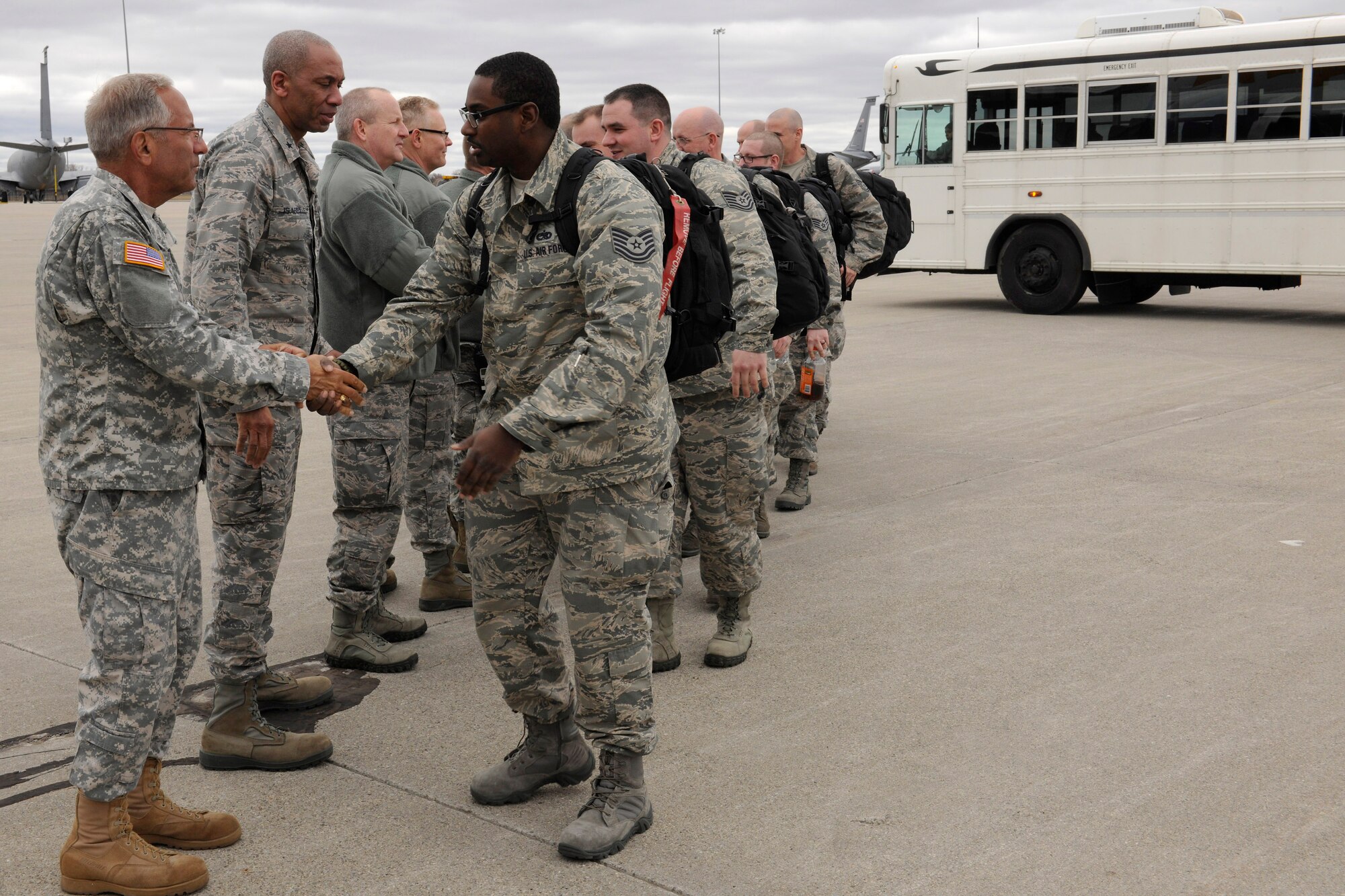 150410-Z-EZ686-073 -- Michigan Airmen prepare to depart Selfridge Air National Guard Base for a deployment to Southwest Asia. Sending off the Airmen are, from left, Major Gen. Gregory J. Vadnais, adjutant general of Michigan; Brig. Gen. Leonard W. Isabelle, Jr., commander of the Michigan Air National Guard; and Brig. Gen. John D. Slocum, commander of the 127th Wing at Selfridge. (U.S. Air National Guard photo by Master Sgt. David Kujawa)
