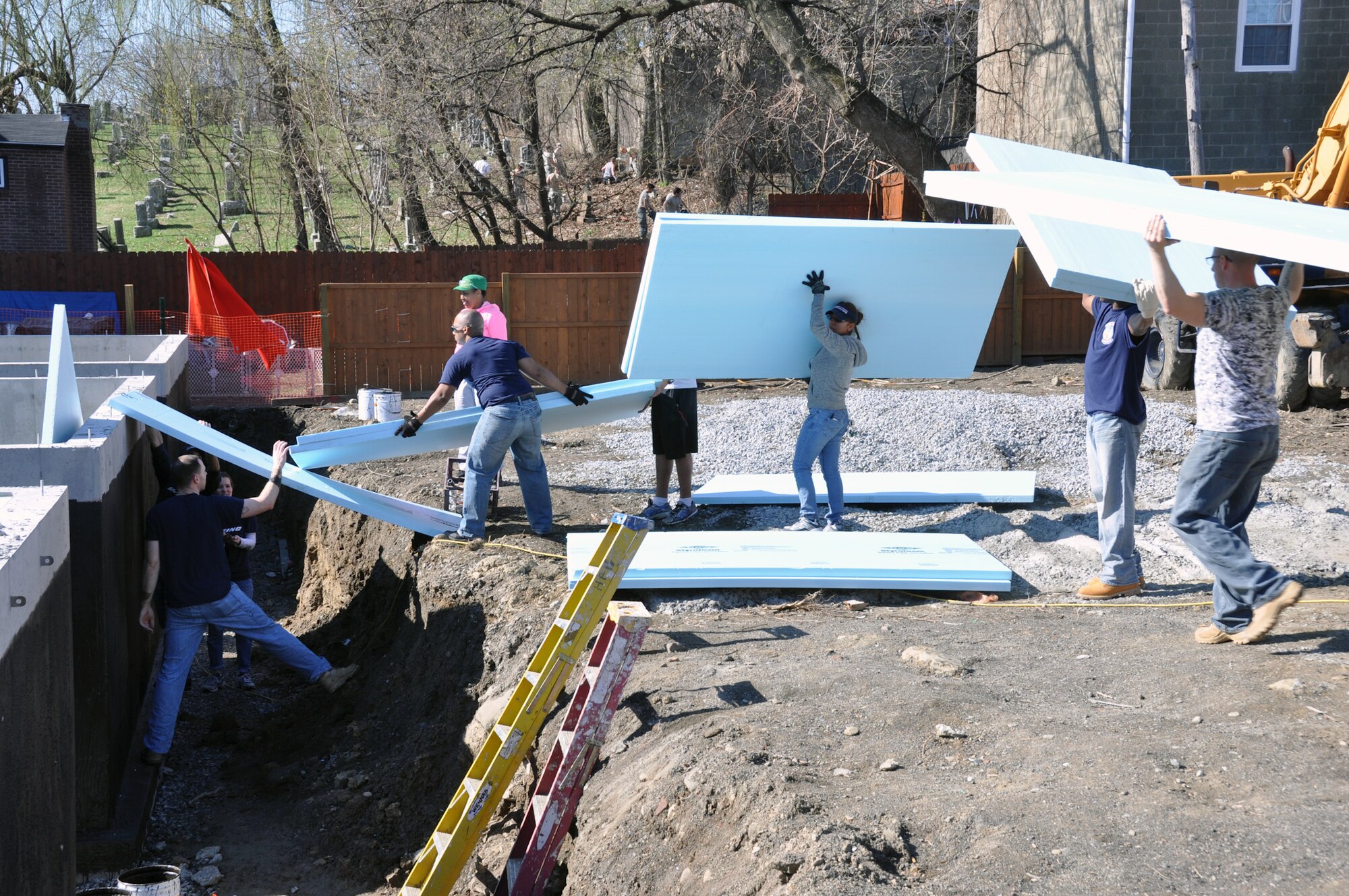Members of the New York Air National Guard's 105th Airlift Wing and Boeing Company use their off-duty time to install insulated panels on a house being built by Habitat for Humanity in Newburgh, N.Y., Saturday, April 18, 2015. The Airmen are members of the Wing's First Six Council, a group for junior Airmen. (U.S. Air National Guard photo by Maj. Patrick Cordova/Released)