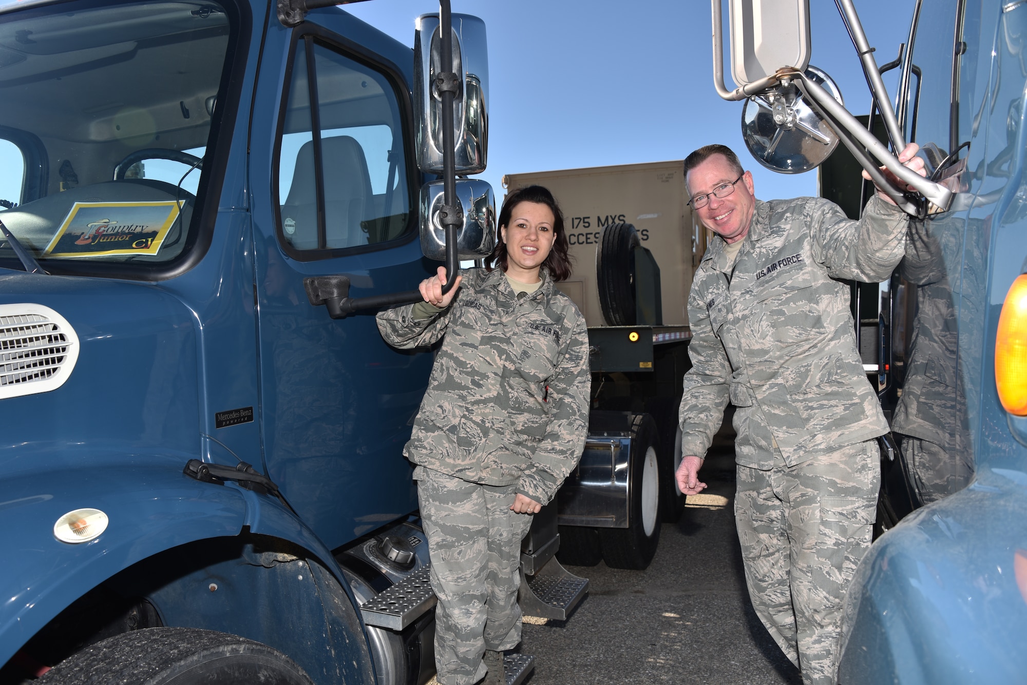 Tech Sgt. Nicole Loucas, Asst. Non Commissioned Officer in charge, Tech Sgt. Bobby Hynes, Non Commissioned Officer in charge are Vehicle Operators with the Maryland Air National Guard. They pose for a photo atop their big rigs as they prepare to send eight vehicles carrying 17 guard members and nearly $15 million in equipment on a 4,680 mile, round-trip from Warfield Air National Guard Base in Baltimore to Tucson, setting the record for a state-side convoy among any active duty or reserve units in the U.S. Air Force. (U.S. Air National Guard photo by Senior Master Sgt. Ed Bard/RELEASED) 