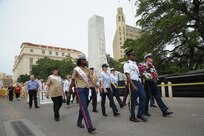 The 2015 military ambassadors carry a wreath and follow the processional April 20 during the annual Fiesta San Antonio Pilgrimage to the Alamo, a memorial tribute to the Alamo heroes and the heritage of Texas. The wreath-bearing procession is a solemn occasion during which historic, civic, patriotic, military and school groups walk silently to the Alamo carrying wreaths, which are placed at the Alamo. (U.S. Air Force photo by Joel Martinez)