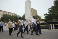 The 2015 military ambassadors carry a wreath and follow the processional April 20 during the annual Fiesta San Antonio Pilgrimage to the Alamo, a memorial tribute to the Alamo heroes and the heritage of Texas. The wreath-bearing procession is a solemn occasion during which historic, civic, patriotic, military and school groups walk silently to the Alamo carrying wreaths, which are placed at the Alamo. (U.S. Air Force photo by Joel Martinez)