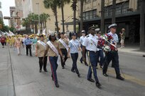 The 2015 military ambassadors carry a wreath and follow the processional April 20 during the annual Fiesta San Antonio Pilgrimage to the Alamo, a memorial tribute to the Alamo heroes and the heritage of Texas. The wreath-bearing procession is a solemn occasion during which historic, civic, patriotic, military and school groups walk silently to the Alamo carrying wreaths, which are placed at the Alamo. (U.S. Air Force photo by Joel Martinez)
