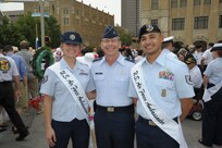 Staff Sgt. Stephanie Hall, 2015 military ambassador, Brig. Gen. Bob LaBrutta, 502nd Air Base Wing and Joint Base San Antonio commander, and Tech. Sgt. Juan Flores, 2015 military ambassador, pose for a photo April 20 before the annual Fiesta San Antonio Pilgrimage to the Alamo event. The wreath-bearing procession is a solemn occasion during which historic, civic, patriotic, military and school groups walk silently to the Alamo carrying wreaths, which are placed at the Alamo. (U.S. Air Force photo by Joel Martinez)