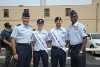 Col. Matthew Isler (left), 12th Flying Training Wing commander, Staff Sgt. Stephanie Hall and Tech. Sgt. Juan Flores, 2015 military ambassadors, and Chief Master Sgt. Troy Palmer, 12th Flying Training Wing command chief master sergeant, pose for a photo April 20 before the annual Fiesta San Antonio Pilgrimage to the Alamo event. The wreath-bearing procession is a solemn occasion during which historic, civic, patriotic, military and school groups walk silently to the Alamo carrying wreaths, which are placed at the Alamo. (U.S. Air Force photo by Joel Martinez)