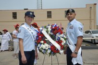 Staff Sgt. Stephanie Hall and Tech. Sgt. Juan Flores, 2015 military ambassadors, pose for a photo April 20 before the annual Fiesta San Antonio Pilgrimage to the Alamo event. The wreath-bearing procession is a solemn occasion during which historic, civic, patriotic, military and school groups walk silently to the Alamo carrying wreaths, which are placed at the Alamo. (U.S. Air Force photo by Joel Martinez)