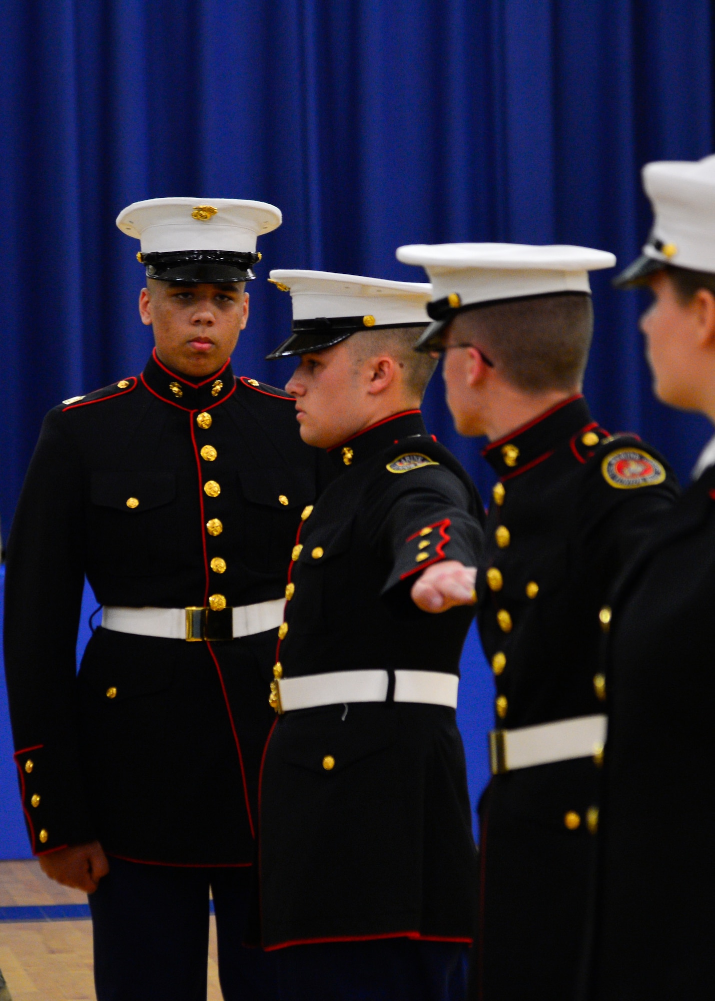 Cadet 1st Sgt. Nethanel Cannon conducts an open-ranks inspection of the Woodbridge High School Marine Corps Junior Reserve Officer Training Corps Drill Team during the 2015 Eagle Classic Delaware State Military Drill Championship April 18, 2015, at Dover Air Force Base Middle School, Del. This is an annual competition for all of the JROTC detachments in the state of Delaware. (U.S. Air Force photo/Airman 1st Class William Johnson)