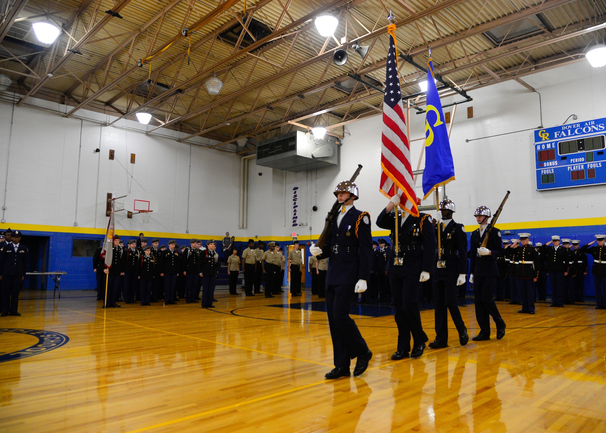 The Caesar Rodney High School Air Force Junior Reserve Officer Training Corps Color Team marches out to present the colors during the opening ceremony of the 2015 Eagle Classic Delaware State Military Drill Championship April 18, 2015, at Dover Air Force Base Middle School, Del. Eight different JROTC programs representing all four service branches competed in the drill competition. (U.S. Air Force photo/Airman 1st Class William Johnson)