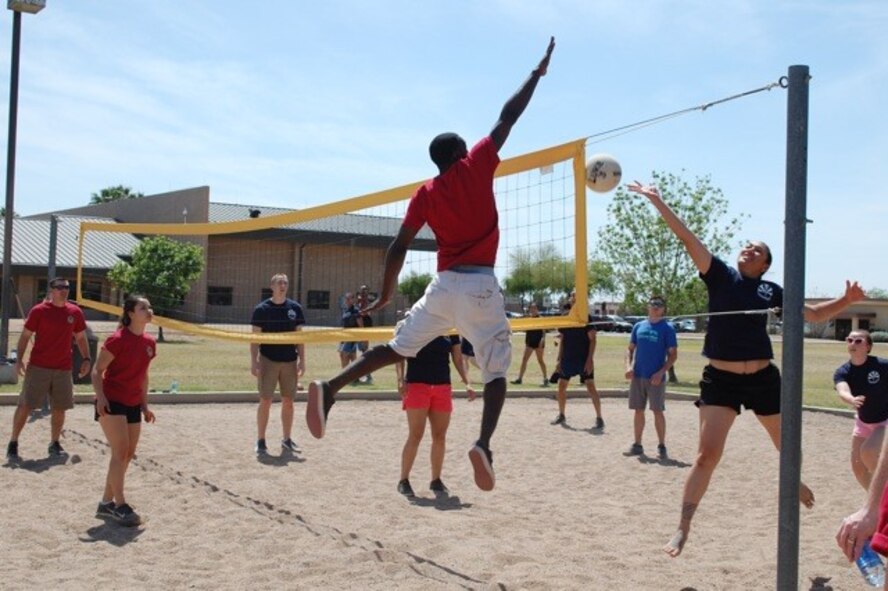 A 56th Medical Support Squadron Airman attempts to block the ball April 3 at the 56th Medical Group Annual Mash Bash at Luke Air Force Base. For the second year in a row, the 56th MDOS won the overall competition. (Courtesy photo) 