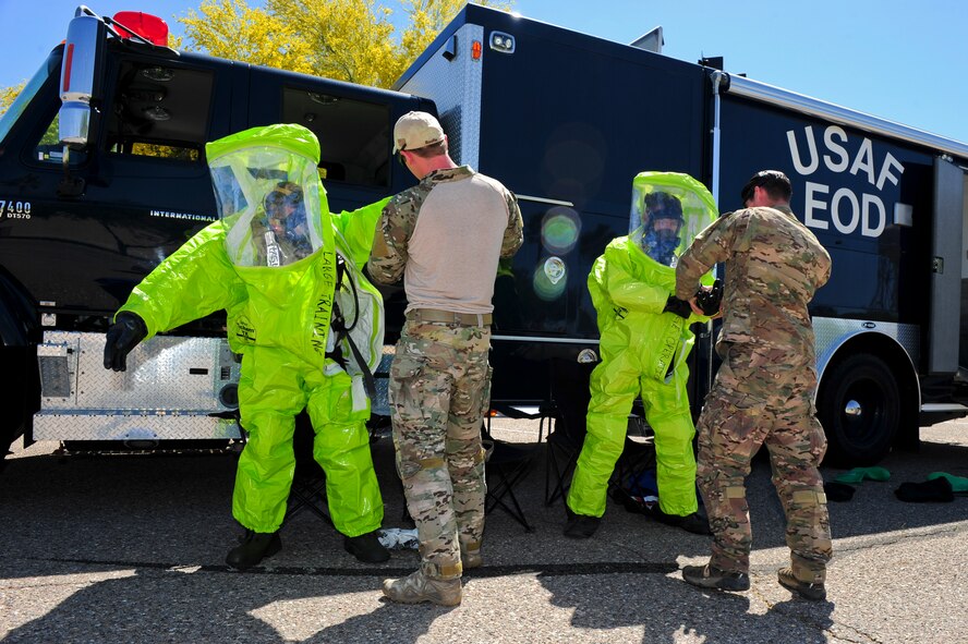 Members of the 355th Civil Engineering Squadron’s Explosive Ordnance Disposal flight dress in Level A chemical suits during a weapons of mass destruction training exercise at Davis-Monthan Air Force Base, Ariz., April 8, 2015. The Level A suits offer the highest level of protection against harmful vapors, gases and particles. (U.S. Air Force photo by Airman 1st Class Chris Drzazgowski/Released)