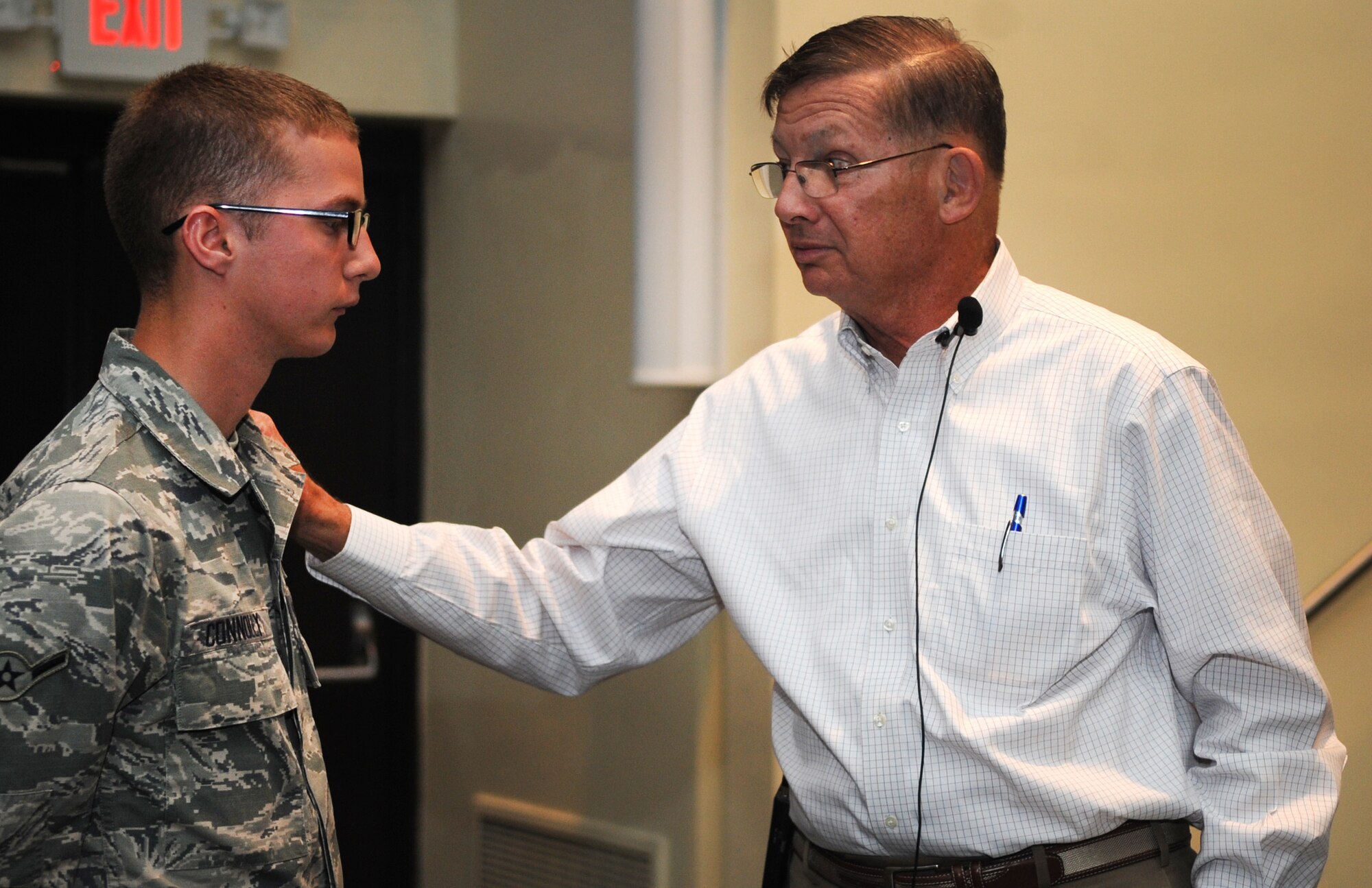 Retired Col. Charles “Chuck” DeBellevue, a Vietnam War ace, interacts with Airman Nathaniel Connolly, 4th Aircraft Maintenance Squadron assistant dedicated crew chief, after a Leadership Lecture Series event, April 16, 2015, at Seymour Johnson Air Force Base, North Carolina. The two discussed the important role of crew chiefs in completing successful flying operations. (U.S. Air Force photo/Senior Airman Ashley J. Thum)