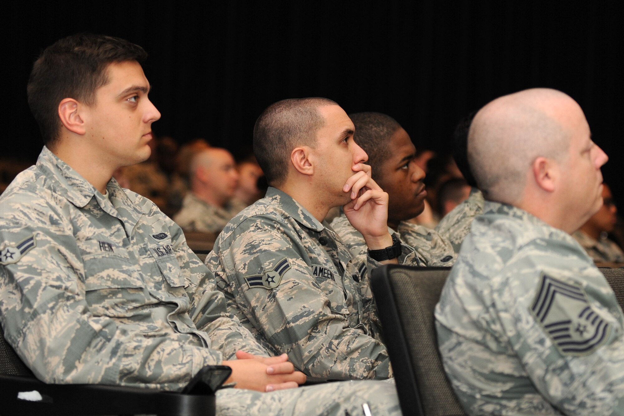 Airmen listen to retired Col. Charles “Chuck” DeBellevue, a Vietnam War ace, recount his experiences during a Leadership Lecture Series event, April 16, 2015, at Seymour Johnson Air Force Base, North Carolina. As a former weapons systems officer, or “backseater,” DeBellevue emphasized the concept of teamwork during his address. (U.S. Air Force photo/Senior Airman Ashley J. Thum)