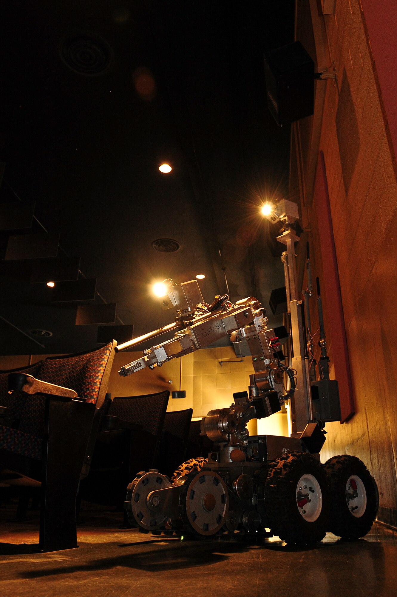 An ANDROS F6A robot is piloted by members of the 355th Civil Engineering Squadron's Explosive Ordnance Disposal flight during a weapons of mass destruction training exercise inside the base theater at Davis-Monthan Air Force Base, Ariz., April 8, 2015. The robot is used for reconnaissance and disabling destructive devices. (U.S. Air Force photo by Airman 1st Class Chris Drzazgowski/Released)