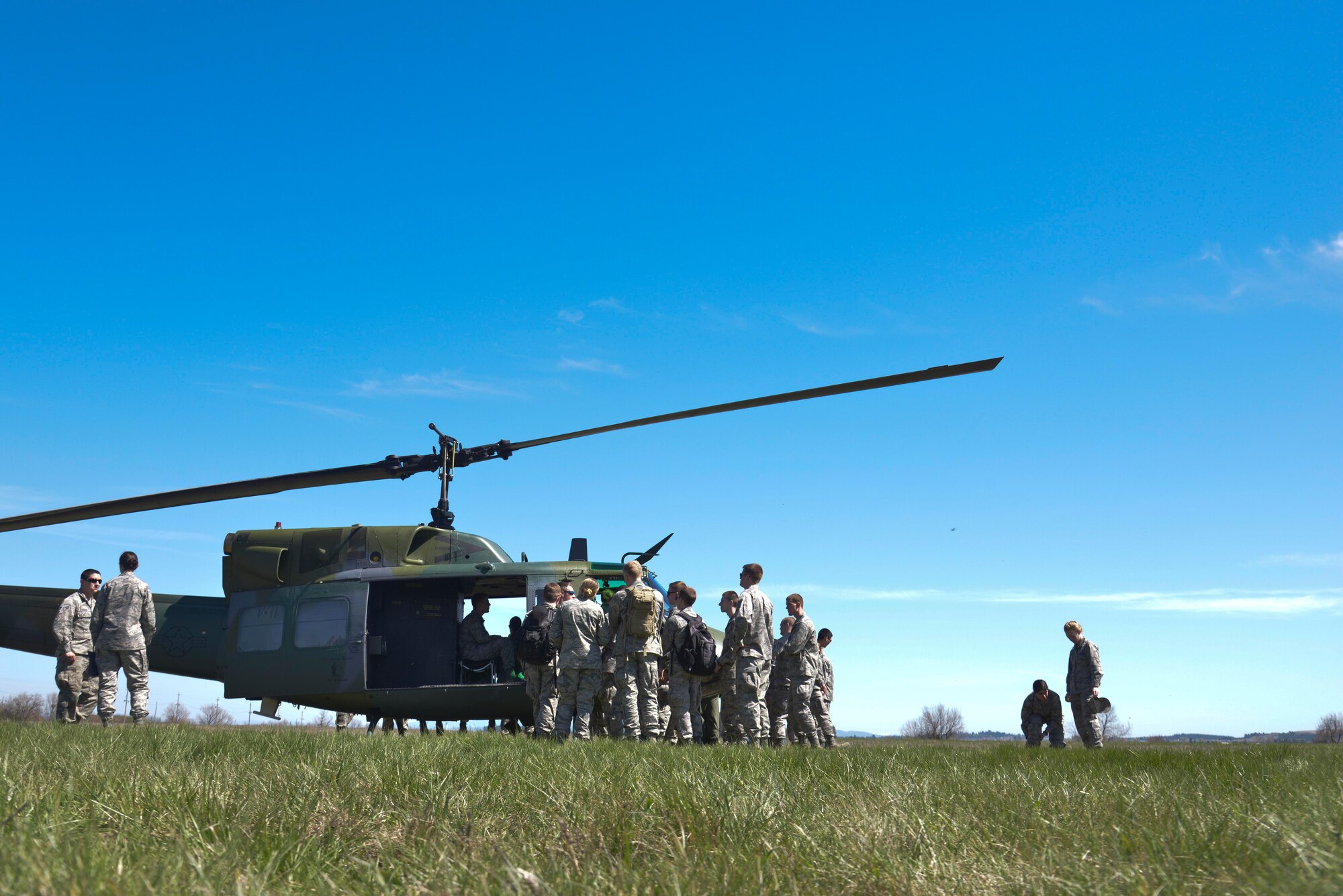 Central Washington University Air Force ROTC students get an up close look of the UH-1N Iroquois helicopter during a base wide tour April 17, 2015, at Fairchild Air Force Base, Wash. The tour gave the students an opportunity to explore several functions that help the base operate. (U.S. Air Force photo/Senior Airman Janelle Patiño)