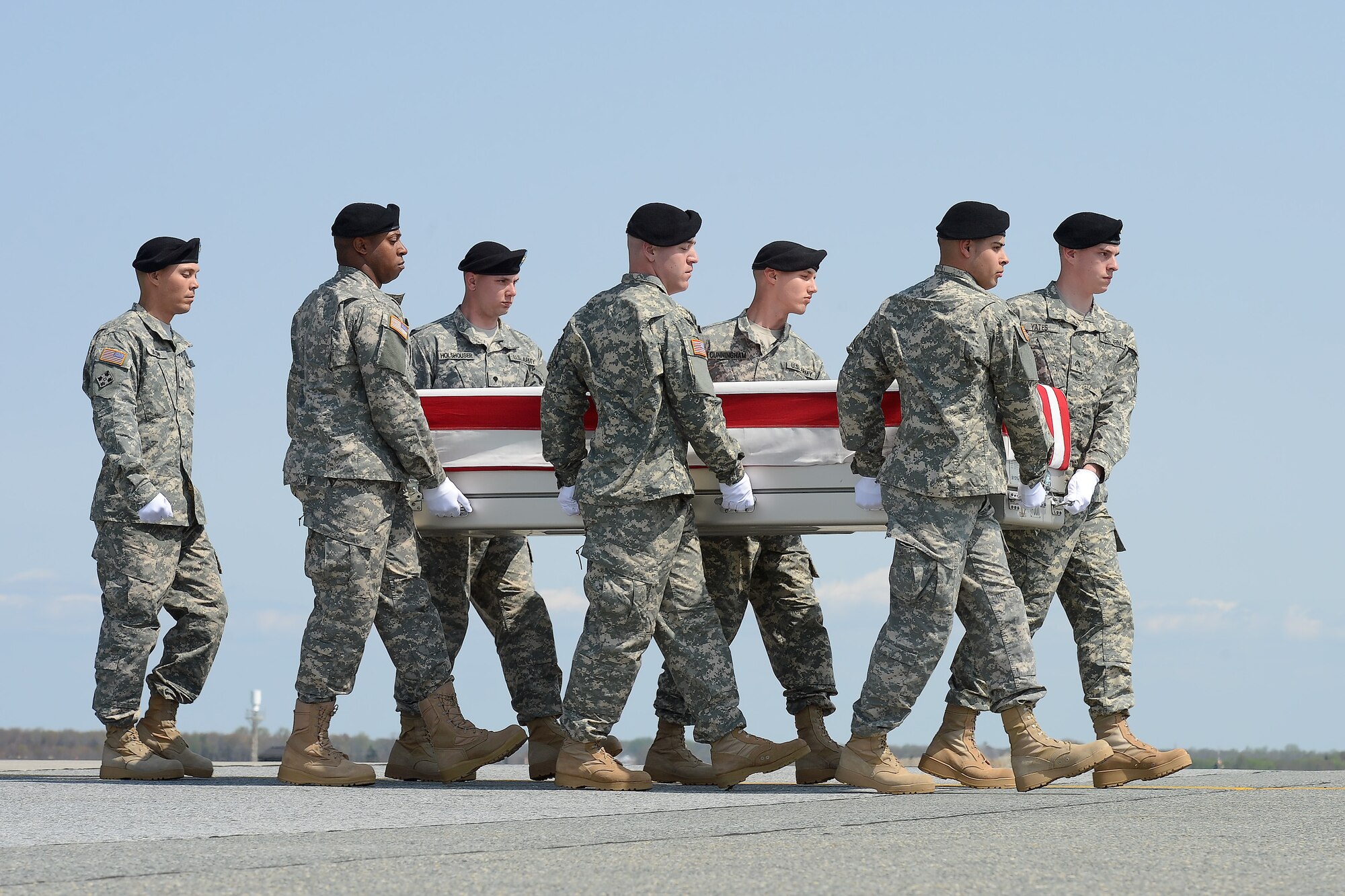 A U.S. Army carry team transfers the remains of Jewel W. Everett, a Dept. of Defense civilian during a dignified transfer ceremony, April 21, 2015, Dover Air Force Base, Del. Everett was assigned to Headquarters and Headquarters Company, Area Support Group-Kuwait, Camp Arifjan, Kuwait. (U.S. Air Force photo/Greg L. Davis)