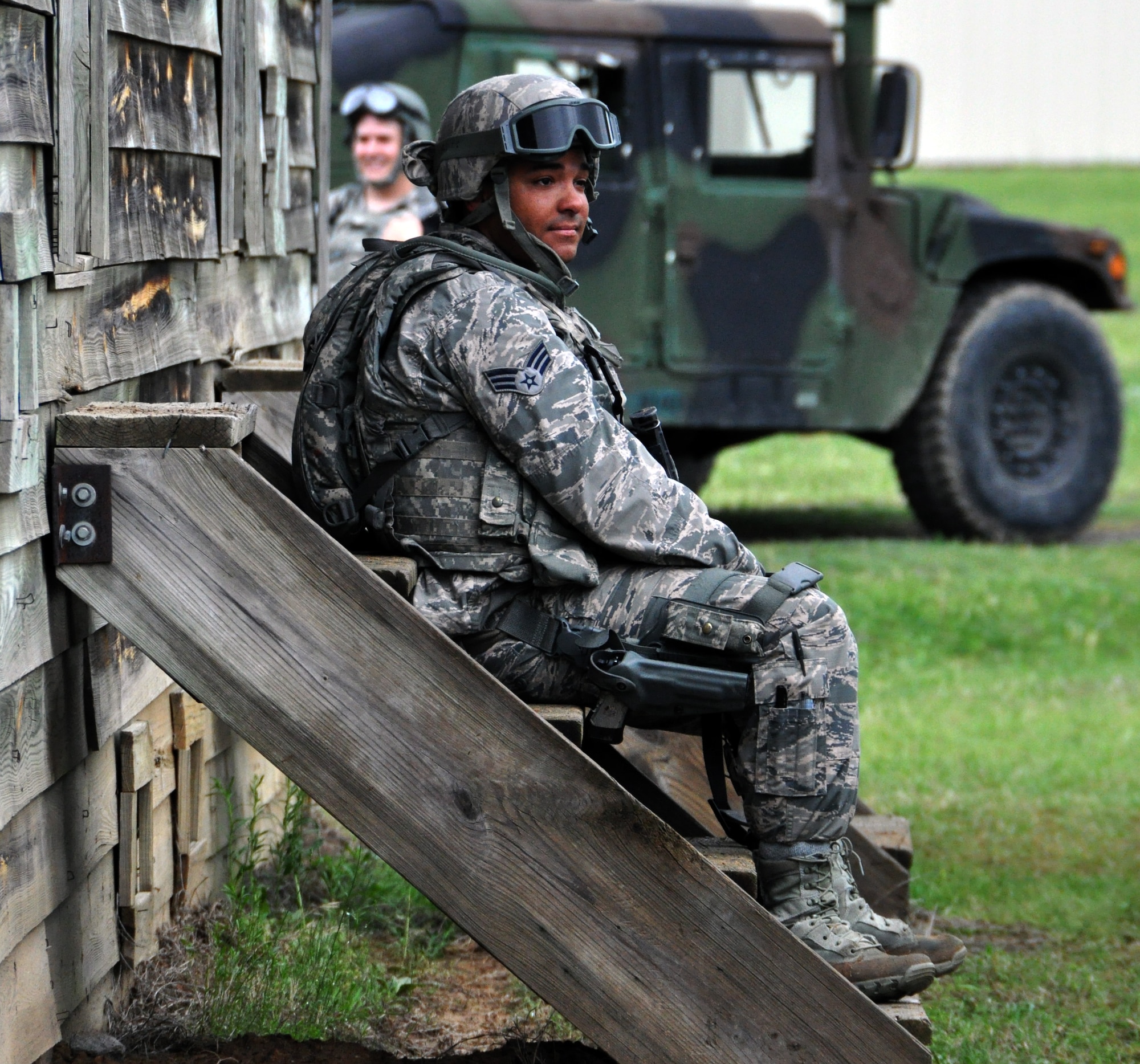 Senior Airman Anthony Davis, 931st Security Forces Squadron, takes a short break after successfully securing an area during a military operations on urban terrain (MOUT) training exercise at Camp Gruber Training Center, Okla., April 15, 2015.  More than 80 members of the  931 SFS and 931st Civil Engineer Squadron participated in ten days of combat skills training at Camp Gruber, which included land navigation, weapons training, tactical movements, convoy operations, base defense, room clearing procedures, foot patrols, military operations on urban terrain (MOUT) and combat lifesaving.  (U.S. Air Force photo by Capt. Zach Anderson)
